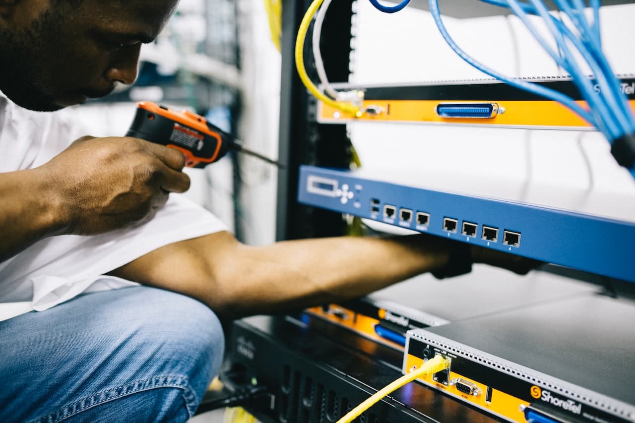 Photo by Field Engineer: https://www.pexels.com/photo/professional-crop-black-technician-working-with-hardware-442154/